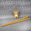 Chopsticks helper with pair of chopsticks